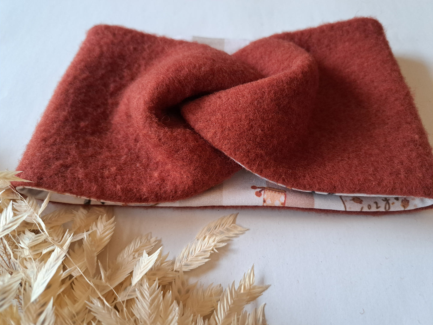 Stirnband Wollfleece 'Virgin Wool' mulesingfrei rost / gestreift